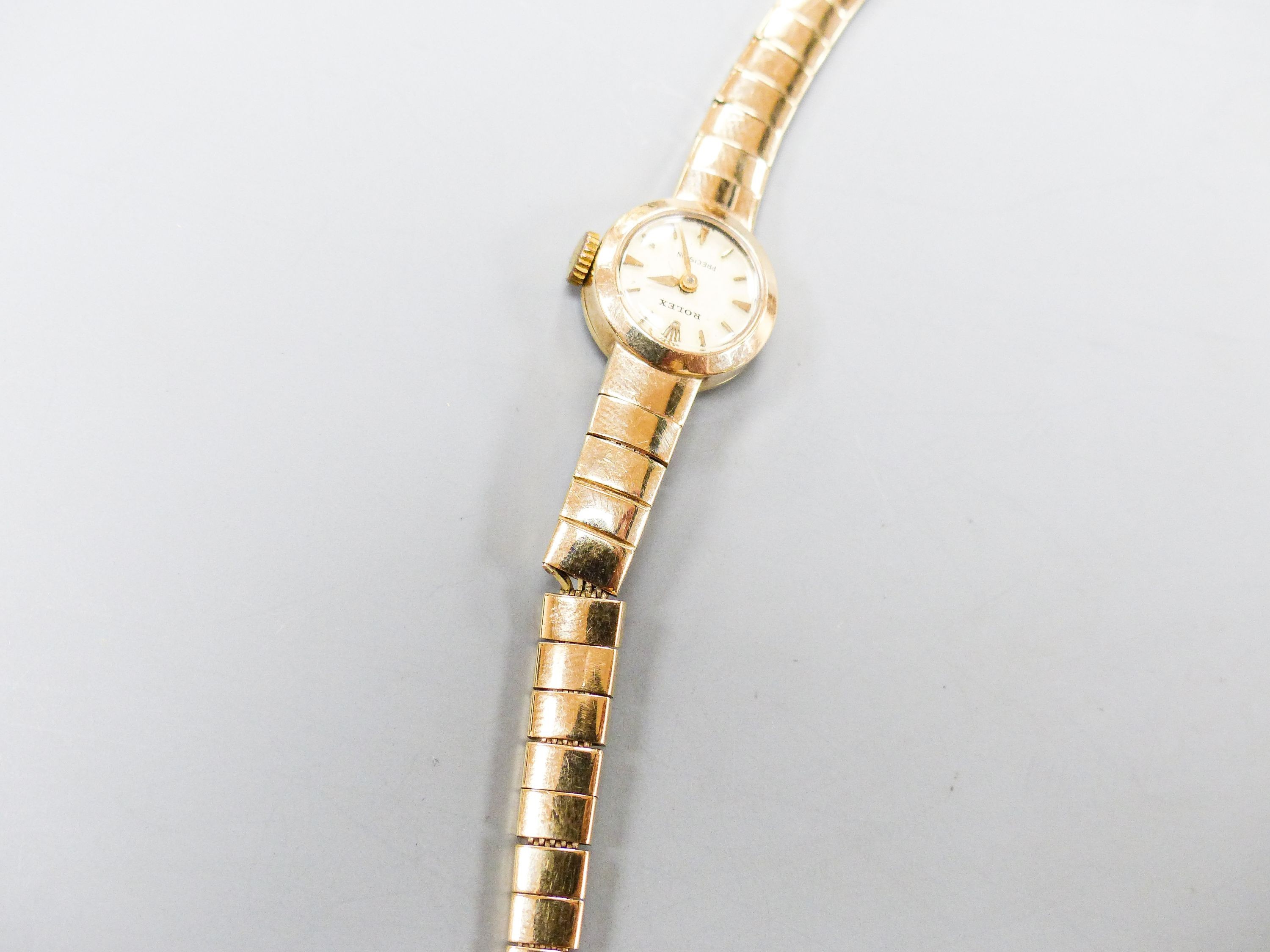 A lady's 9ct gold Rolex manual wind wrist watch on 9ct gold strap, case diameter 15mm